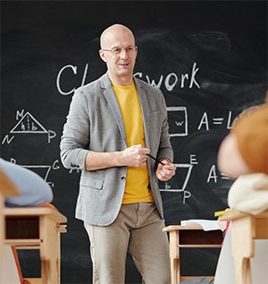 Teacher standing at the front of a class